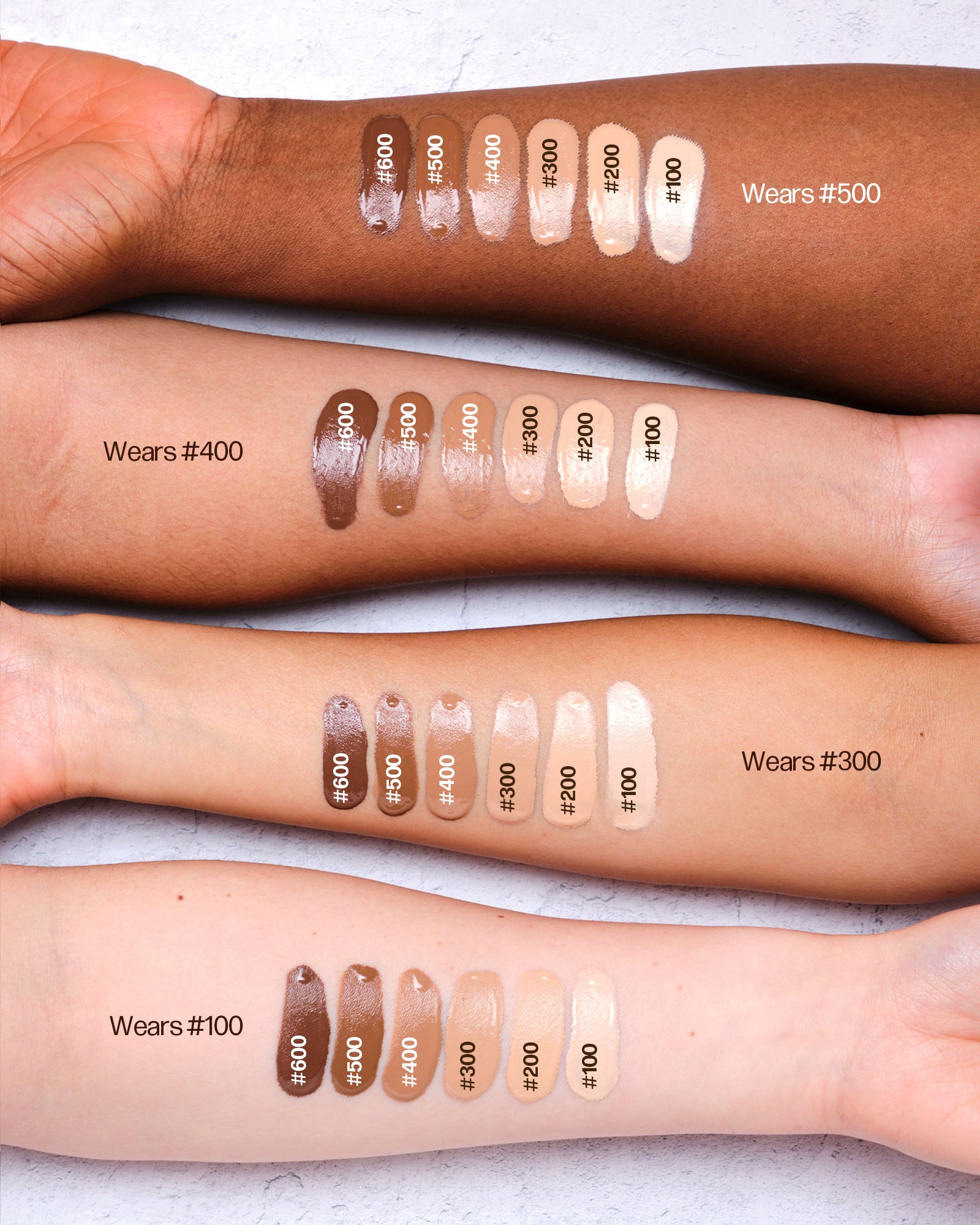 a group of people with different shades of makeup on their arms