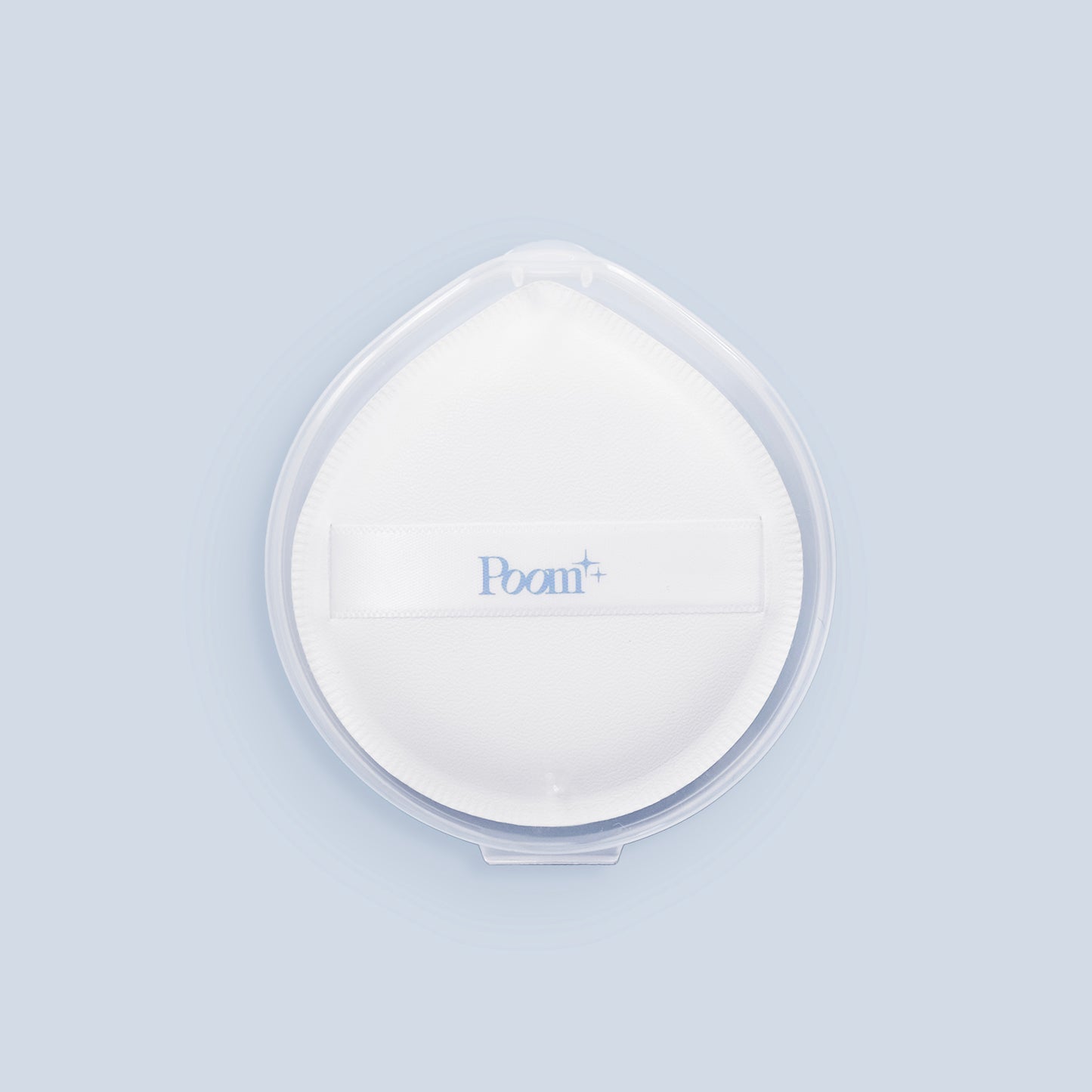 White sponge with 'Poom' branding on a light blue background