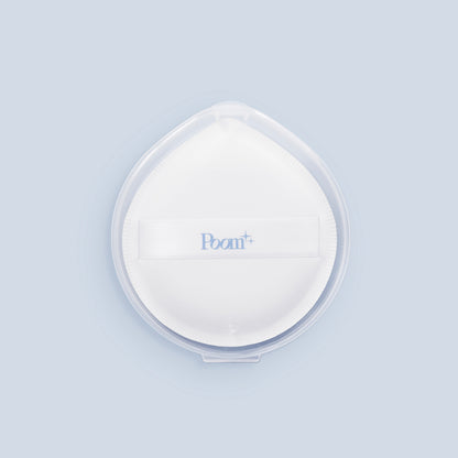 White sponge with 'Poom' branding on a light blue background