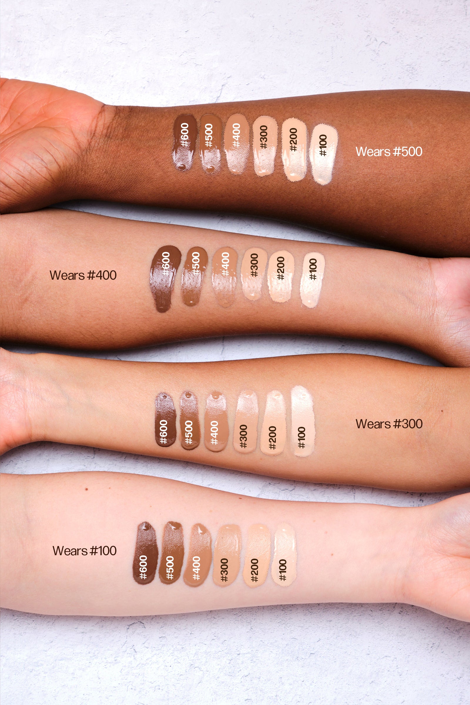a group of people with different shades of makeup on their arms